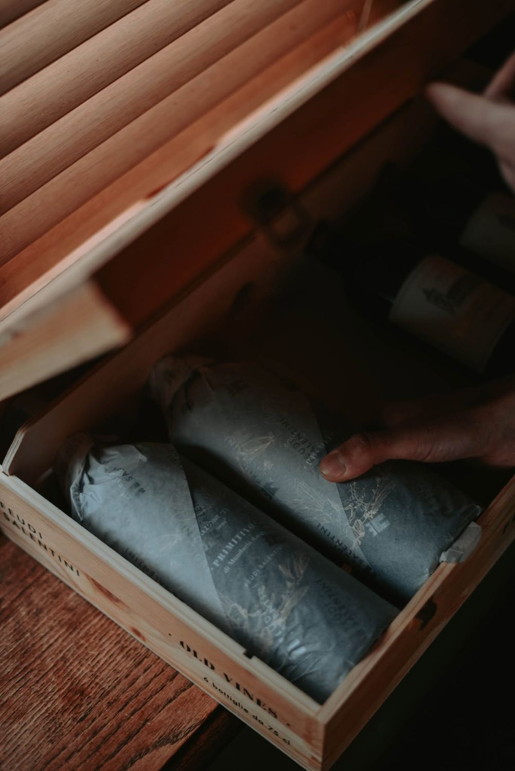 Crate of wrapped wine bottles from Wijnkoperij Van Lieverlee